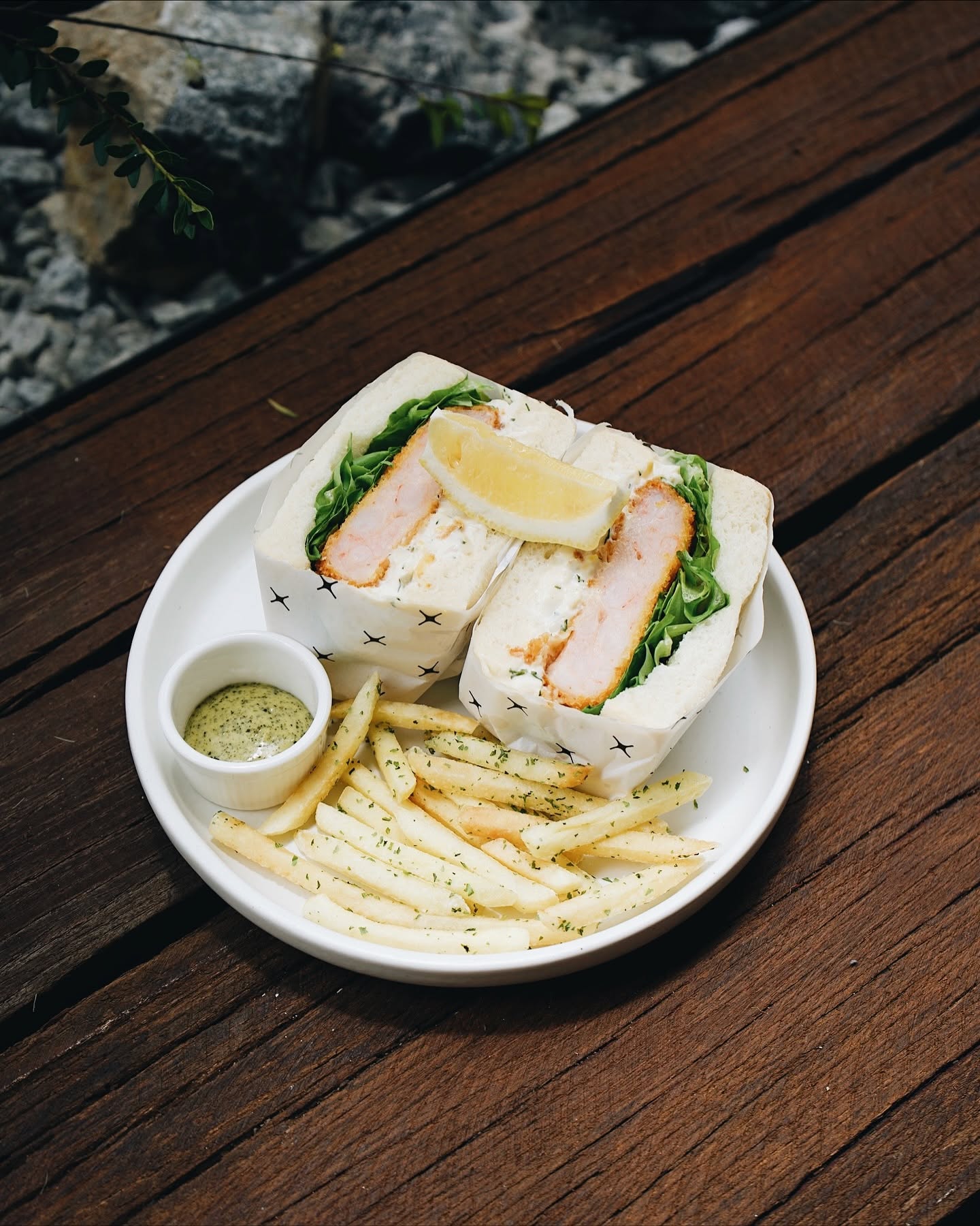 Katsu sando on ONO star-print paper with herb-dusted fries and dipping sauce